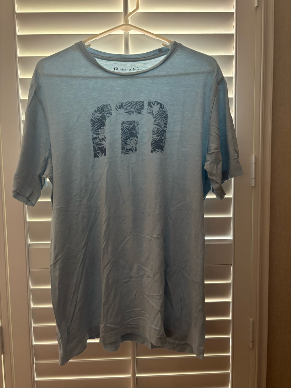 Travis Mathew Light Blue Short Sleeve Tee with Palm Logo